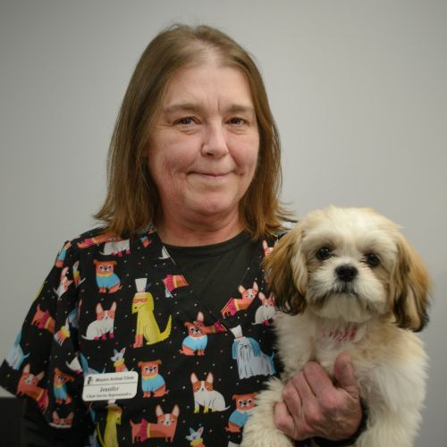 Jennifer holding a dog